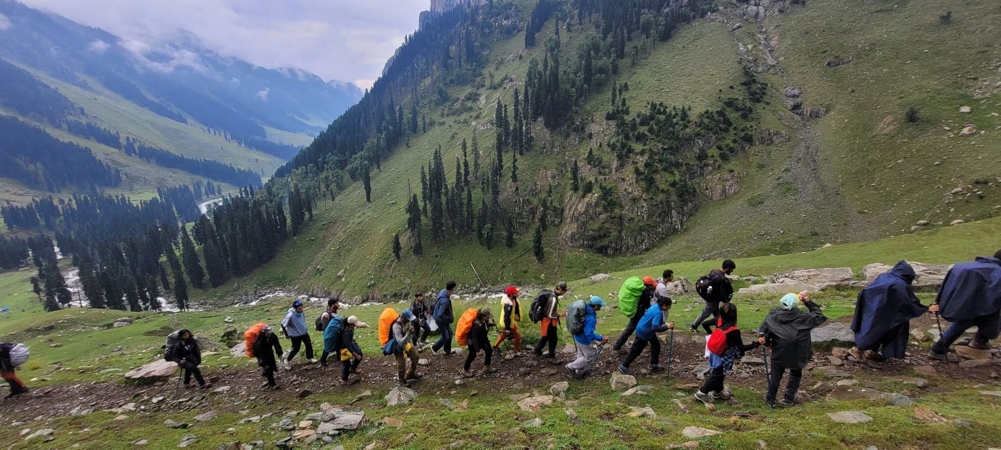 Adventurers exploring a mountain valley